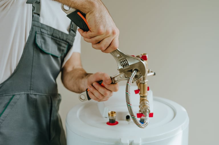 Plumber repairing a water heater